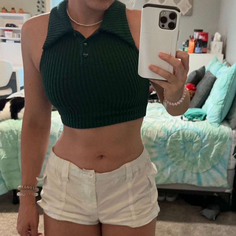 two tank tops, red is size small green is xs